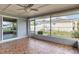 Screened porch with tile floor and sliding glass door at 5221 Lemon Bay Dr, Venice, FL 34293