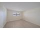Bright bedroom features wood-look flooring and a double window at 5790 Midnight Pass Rd # 602, Sarasota, FL 34242
