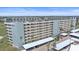 High angle view of the condo building and parking from the back side at 5790 Midnight Pass Rd # 602, Sarasota, FL 34242