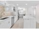 Modern kitchen featuring stainless steel appliances, and ample counter space, creating a functional and well-designed culinary area at 5790 Midnight Pass Rd # 602, Sarasota, FL 34242