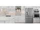 Contemporary kitchen with stainless steel appliances, stylish cabinetry, and a unique backsplash, creating a luxurious culinary experience at 5790 Midnight Pass Rd # 602, Sarasota, FL 34242