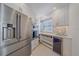 Modern kitchen with stainless steel refrigerator and plenty of storage space at 5790 Midnight Pass Rd # 602, Sarasota, FL 34242