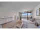 Bright living room with balcony view and neutral decor at 5790 Midnight Pass Rd # 602, Sarasota, FL 34242