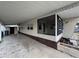 Covered carport alongside the manufactured home at 611 50Th Avenue W Dr, Bradenton, FL 34207