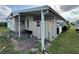Side view of the manufactured home showcasing additional storage at 611 50Th Avenue W Dr, Bradenton, FL 34207