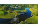 Aerial view of the golf course with water features at 704 Harrington Lake S Dr # 6, Venice, FL 34293