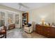 Bright office featuring a bay window, built-in shelving, and comfortable seating at 704 Harrington Lake S Dr # 6, Venice, FL 34293