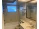 Bathroom with bathtub, toilet, and vanity at 7220 San Carlos Dr, Port Richey, FL 34668