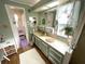 Bright bathroom with a vanity, shower, and decorative accents at 727 Blackburn Blvd, North Port, FL 34287