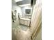 Well-lit bathroom with a single vanity and shower at 727 Blackburn Blvd, North Port, FL 34287