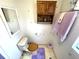 Simple bathroom with toilet and updated vanity at 727 Blackburn Blvd, North Port, FL 34287
