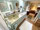 Clean bathroom with a vanity and a view into the bedroom at 727 Blackburn Blvd, North Port, FL 34287