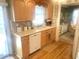 Light wood kitchen cabinets and white appliances at 727 Blackburn Blvd, North Port, FL 34287