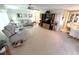 Relaxing living room featuring comfortable recliner sofas and built-in entertainment center at 727 Blackburn Blvd, North Port, FL 34287
