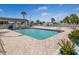 Community pool with ample deck space for lounging at 727 Blackburn Blvd, North Port, FL 34287