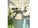 Spacious sunroom showcasing a variety of plants and comfortable seating arrangements at 727 Blackburn Blvd, North Port, FL 34287