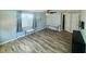 Bright room with tile floors, ceiling fan, air conditioner, and good lighting at 113 Colonia W Ln, Nokomis, FL 34275