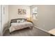 Bright bedroom with a daybed, soft neutral walls, carpeting, and natural light from the window at 12837 Oriago St, Venice, FL 34293