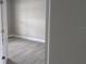 Bedroom with tile flooring, neutral paint and white trim at 14464 Fort Myers Ave, Port Charlotte, FL 33981