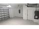 Spacious garage with ample room for storage and a roll-up door at 14464 Fort Myers Ave, Port Charlotte, FL 33981