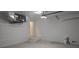 Clean and spacious garage offering ample storage space and access door at 14464 Fort Myers Ave, Port Charlotte, FL 33981
