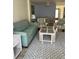 Comfortable living room featuring stylish decor, a cozy sofa, and elegant furnishings at 232 Saint Augustine Ave # 404, Venice, FL 34285