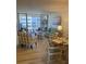 Inviting living room with sliding glass doors to balcony and stylish furnishings and decor at 232 Saint Augustine Ave # 404, Venice, FL 34285