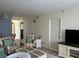 Spacious living room with a view to the dining area, offering a harmonious living space at 232 Saint Augustine Ave # 404, Venice, FL 34285