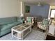 Comfortable living room featuring stylish decor, a cozy sofa, and elegant furnishings at 232 Saint Augustine Ave # 404, Venice, FL 34285