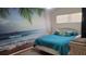 Bedroom featuring a beachy mural, wicker furniture and a blue quilt at 300 Base E Ave # 123, Venice, FL 34285