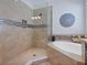 This bathroom showcases a tiled walk-in shower and a soaking tub at 5930 Anise Dr, Sarasota, FL 34238