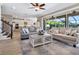 Spacious living room with abundant natural light and an open concept kitchen at 5930 Anise Dr, Sarasota, FL 34238