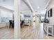 Bright living room featuring wood-look tile floors and open floor plan at 5930 Anise Dr, Sarasota, FL 34238
