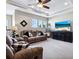 Inviting upstairs loft features plush carpet, tray ceiling, and natural light at 5930 Anise Dr, Sarasota, FL 34238