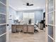 Stylish home office with a large window and French doors at 5930 Anise Dr, Sarasota, FL 34238