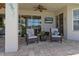 Outdoor patio with cozy seating and a TV at 5930 Anise Dr, Sarasota, FL 34238