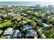Aerial view of a charming home with beach and park access, lush landscaping and serene surroundings at 705 Armada N Rd, Venice, FL 34285