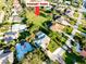 An aerial view showcasing the home's proximity to a pocket park and other residences in the neighborhood at 705 Armada N Rd, Venice, FL 34285