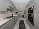 Open concept kitchen showcasing subway tile, quartz countertops, and stainless steel appliances at 705 Armada N Rd, Venice, FL 34285