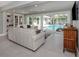 Stylish living room with pool views, comfortable seating, and modern decor at 705 Armada N Rd, Venice, FL 34285