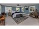 Calm main bedroom featuring tile flooring, shutters on the windows, and coastal inspired decor at 705 Armada N Rd, Venice, FL 34285
