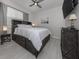 Comfortable bedroom featuring a large bed with storage, stylish decor, and ample natural light at 11601 Parrotfish St, Venice, FL 34292