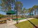 Enjoy a friendly game of bocce ball at the community court, nestled by the lake and shaded by mature trees at 11601 Parrotfish St, Venice, FL 34292