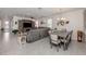 Spacious open concept living and dining room with large windows, tile floors, and neutral colors at 11601 Parrotfish St, Venice, FL 34292