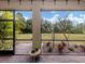 Screened lanai offers a relaxing outdoor space with views of the lush landscaped backyard at 11601 Parrotfish St, Venice, FL 34292