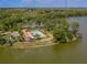 Aerial view of community pool, clubhouse, and surrounding landscape, offering a resort-style experience at 11601 Parrotfish St, Venice, FL 34292