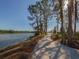 Scenic walking path is beside the tranquil lake and is surrounded by trees, making it a perfect retreat for exercise at 11601 Parrotfish St, Venice, FL 34292