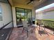 Relaxing screened-in lanai with comfortable seating and a grill at 13164 Rinella St, Venice, FL 34293