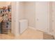 Ample storage space with shelving and a freezer for organized living at 13164 Rinella St, Venice, FL 34293