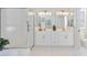 Bright bathroom featuring a shower, tub, and double vanity sinks at 1348 Reserve Dr, Venice, FL 34285